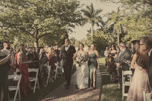 Jen and Lawrence walking up the aisle after their outdoor ceremony